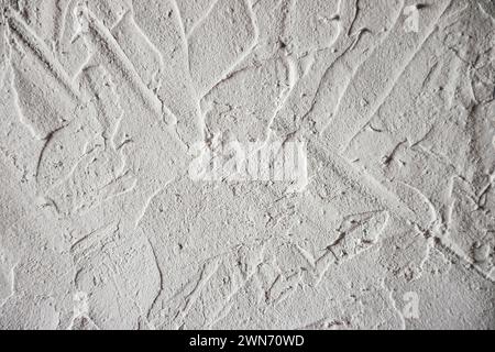 Old gray concrete wall. Concrete texture, closeup. Background texture of modern gray concrete wall. Wall made of blocks. Texture of plastered columns. Stock Photo