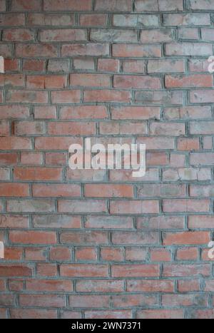 Hand made brick wall made from bricks, abstract background texture with old dirty and vintage style pattern. Red grunge brick in the wall with gray pu Stock Photo
