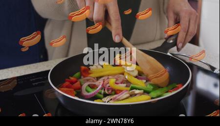 Image of hot dogs icons with senior caucasian couple cooking Stock Photo