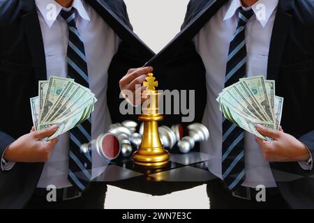 business men showing dollars bank note in hand with golden king chess on board ,business earning strategy concept Stock Photo