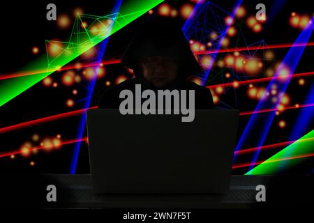 the hacker using laptop online hack secret information world wild Stock Photo