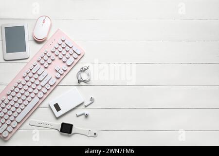 Composition with different modern gadgets on white wooden background Stock Photo
