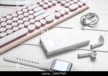 Composition with different modern gadgets on white wooden background, closeup Stock Photo