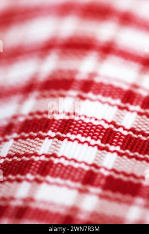 Checkered, cloth and closeup on textile with pattern, color or cotton fabric of picnic blanket. Plaid, tablecloth and lines in motif or traditional Stock Photo