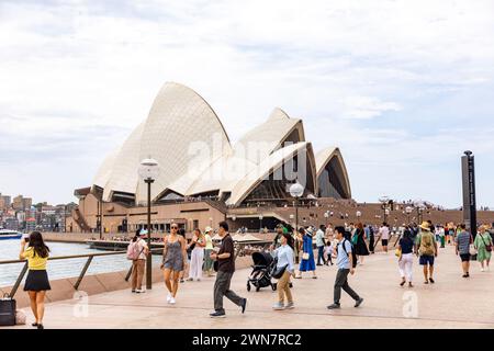 Sydney Opera House building, 2024, at bennelong point in Sydney with people enjoying lunch at Sydney opera house bar and restaurant, iconic Stock Photo