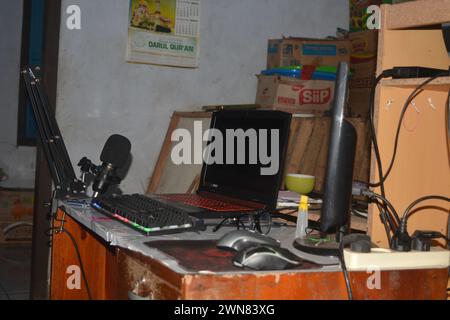 28 September 2023, Photo of work desk with laptop, computer, cup of coffee.Indonesia Stock Photo