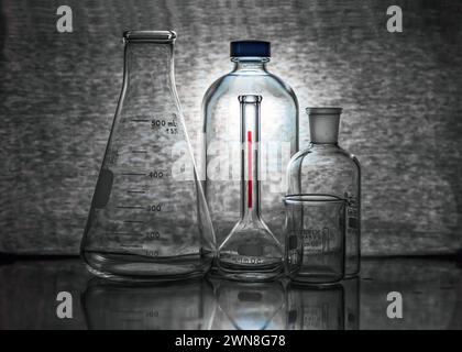 Group of laboratory flasks backlight view. Stock Photo
