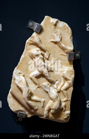 Fragment of a shield of Athena Parthernos from Rome, via Merulana - Lunense marble, mid 2nd century AD - Museo Centrale Montemartini, Rome, Italy Stock Photo