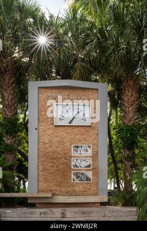 Vertical view of giant outdoor art deco clock thermometer on Ocean Drive, Miami Beach, Florida, USA Stock Photo