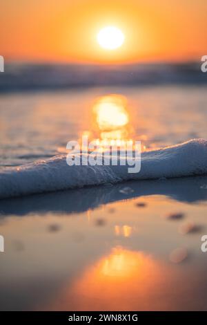 Sun going down on the ocean Stock Photo
