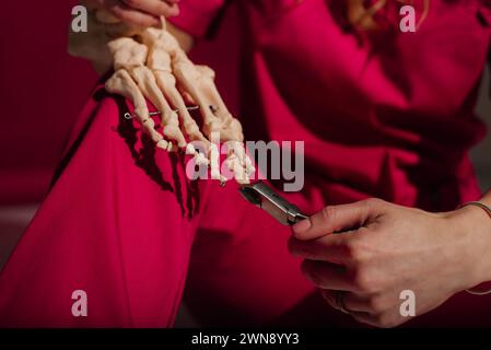 Doctor explaining operation to foot on bone model Stock Photo