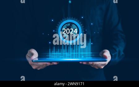 Businessman show graph corporate growth 2024 on tablet, New business startup and Goals target for 2024, Plans and Visions for Year 2024, Business Data Stock Photo