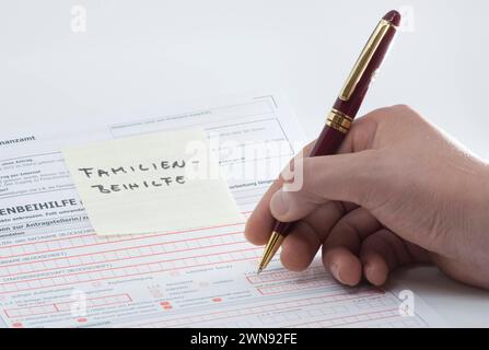 filling in the application for family allowance, financial support from the state filling in the application for family allowance Stock Photo