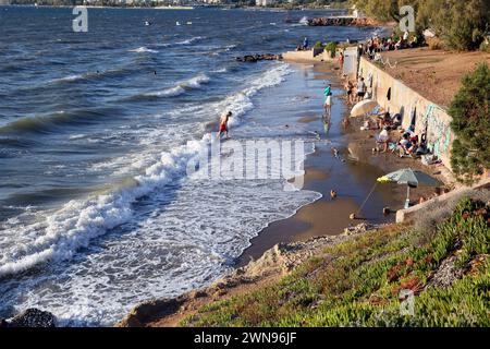 Tourists on Vouliagmeni Beach Athens Greece Stock Photo