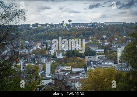 View of a city with many buildings, trees and a cloudy sky on a hill, water towers Hatzfeld, Barmen, Wuppertal, North Rhine-Westphalia Stock Photo