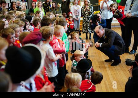 The Prince of Wales meets pupils during a visit to Ysgol Yr Holl Saint/All Saint's School in Wrexham to see how the school is celebrating St David's Day and hear about how it is teaching its pupils about local Welsh history and cultural traditions. Picture date: Friday March 1, 2024. Stock Photo