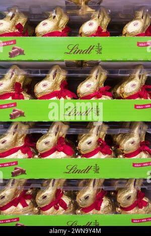 Close up of Lindt Golden Milk Easter Chocolate bunnies on a shelf in a shop in the UK Stock Photo
