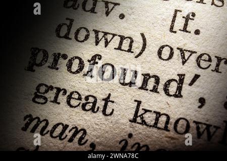 Word profound on dictionary page, macro close-up Stock Photo