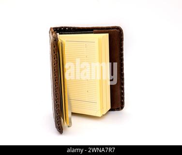 Open Notepad in dark brown genuine leather covers on a white background Stock Photo