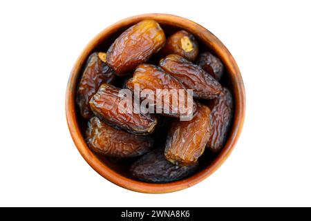 Dates fruit in a bowl isolated on a white background, Clipping path included for easy selection Stock Photo