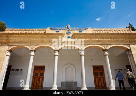 Main symbol of Zoroastrianism - the Faravahar, aka the Foruhar, or the Farre Kiyani, depicted on the facade of Zoroastrian Fire Temple in Yazd, Iran. Stock Photo