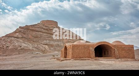 View of the Tower of Silence and old Khayleh (Kheyla), building for relatives of the deceased to rest during Zoroastrian burial ceremony. Yazd, Iran. Stock Photo