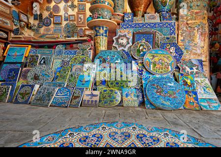 A selection of handmade pottery and ceramics displayed in a gift shop in the historical Fahadan Neighborhood of Yazd, Iran. Stock Photo
