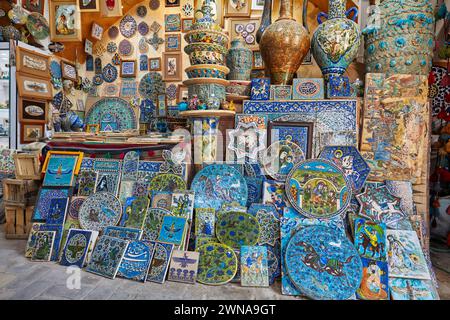 A selection of traditional handmade pottery and ceramics displayed in a gift shop in the historical Fahadan Neighborhood of Yazd, Iran. Stock Photo