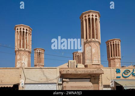 The windcatchers - traditional towers for cross ventilation and passive cooling of buildings. Yazd, Iran. Stock Photo