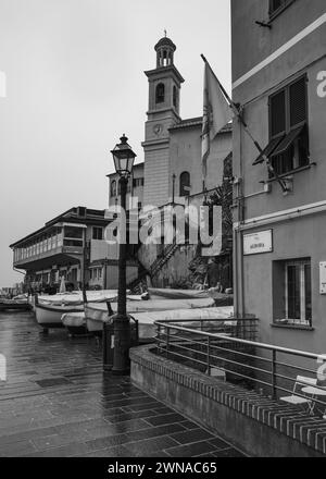 Embracing the beauty of Genoa in the rain through my lens. Every droplet tells a story, every puddle reflects a moment in time. Stock Photo