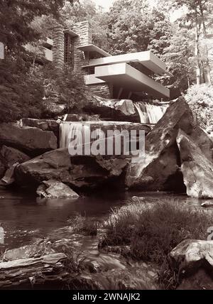 Fallingwater, an organic architecture house designed by architect Frank Lloyd Wright in the 1930s, built partially over a waterfall on the Bear Run river in the Mill Run section of Stewart Township, Pennsylvania. (USA) Stock Photo