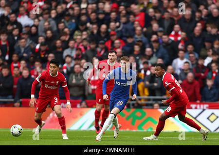 Cole Palmer of Chelsea in action with Wataru Endo (L) and Ryan Gravenberch (R) of Liverpool - Chelsea v Liverpool, Carabao Cup Final, Wembley Stadium, London, UK - 25th February 2024 Editorial Use Only - DataCo restrictions apply Stock Photo