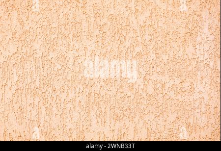 Texture of beige plaster building coating background. Arbitrary pattern. Stock Photo