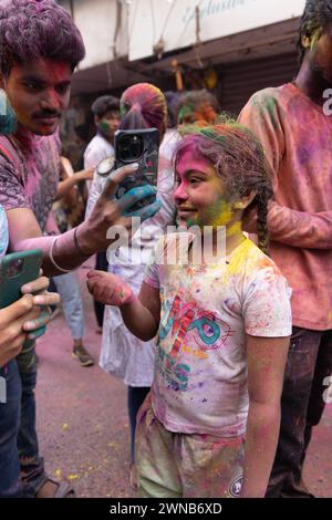 Chennai, Tamilnadu India - March 08 2023 : colorful street Holi celebration by large number of local people in Mint street, Holi festival portrait or Stock Photo