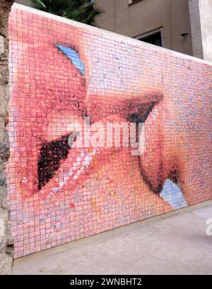 One of the most photographed murals in Barcelona is The Kiss of Freedom also known as The World Begins with Every Kiss. Stock Photo