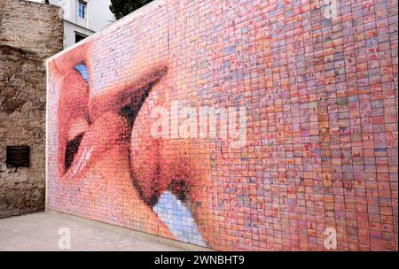 One of the most photographed murals in Barcelona is The Kiss of Freedom also known as The World Begins with Every Kiss. Stock Photo