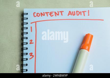 Concept of Content Audit! write on book isolated on Wooden Table. Stock Photo