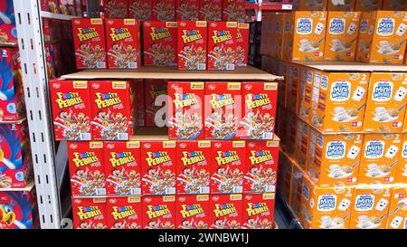 Colorful Array of Fruity Pebbles Cereal Boxes on Supermarket Shelf Stock Photo