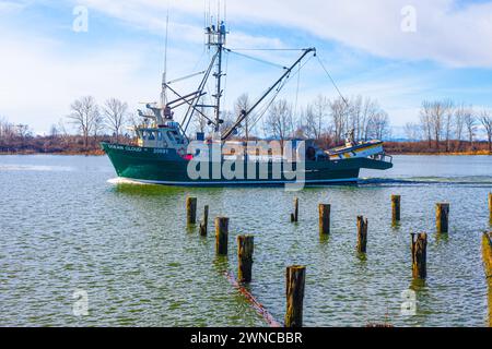 Commercial fishing vessel returning to Steveston Harbour in Canada Stock Photo