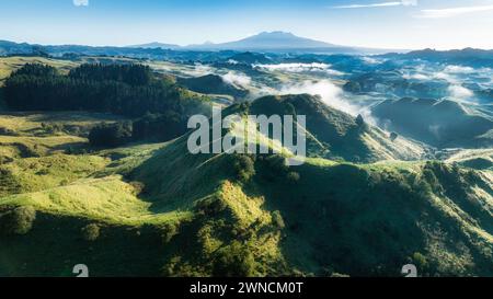 Magical mystical morning cloud in the valleys with a backdrop of the central plateau mountains captured by a drone Stock Photo