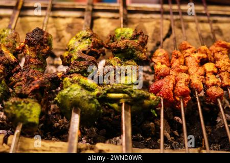 Grilled chicken skewers on a barbecue grill, close-up, Famous Food, Street Food Stock Photo