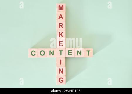 Content marketing strategy concept. Crossword puzzle flat lay typography in green background. Stock Photo