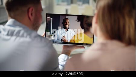 Couple Watching Movie On Tablet At Sofa Stock Photo