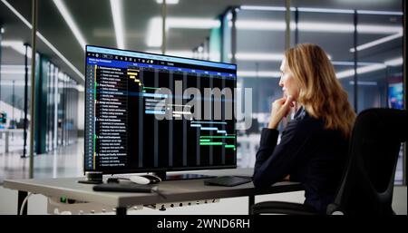 Data Analyst Woman Using Spreadsheet On Computer Stock Photo
