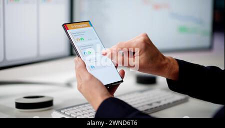 Digital Calendar Schedule Software In Office. Scrum Mobile Phone App Stock Photo