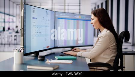 Accountant Using E Invoice Software At Computer In Office Stock Photo