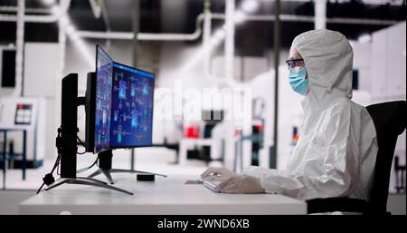 Sterile Semiconductor Manufacturing Factory And Worker In Coverall Stock Photo