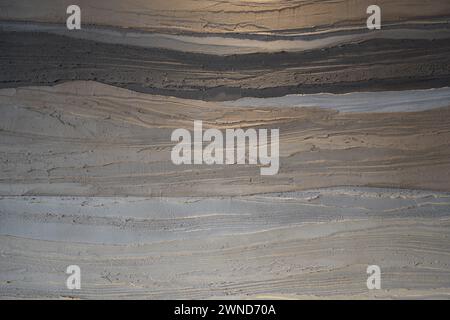 Beige and black wavy marble wall Stock Photo