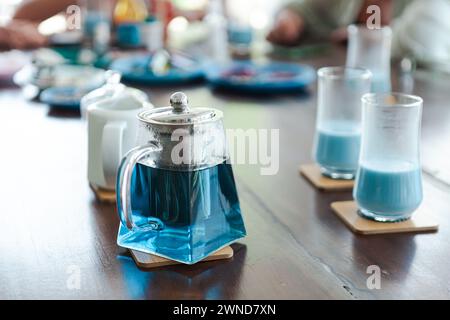 Teapot with two glasses on the table, cozy setting Stock Photo
