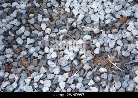 Gray gravel scattered on the ground. Stock Photo